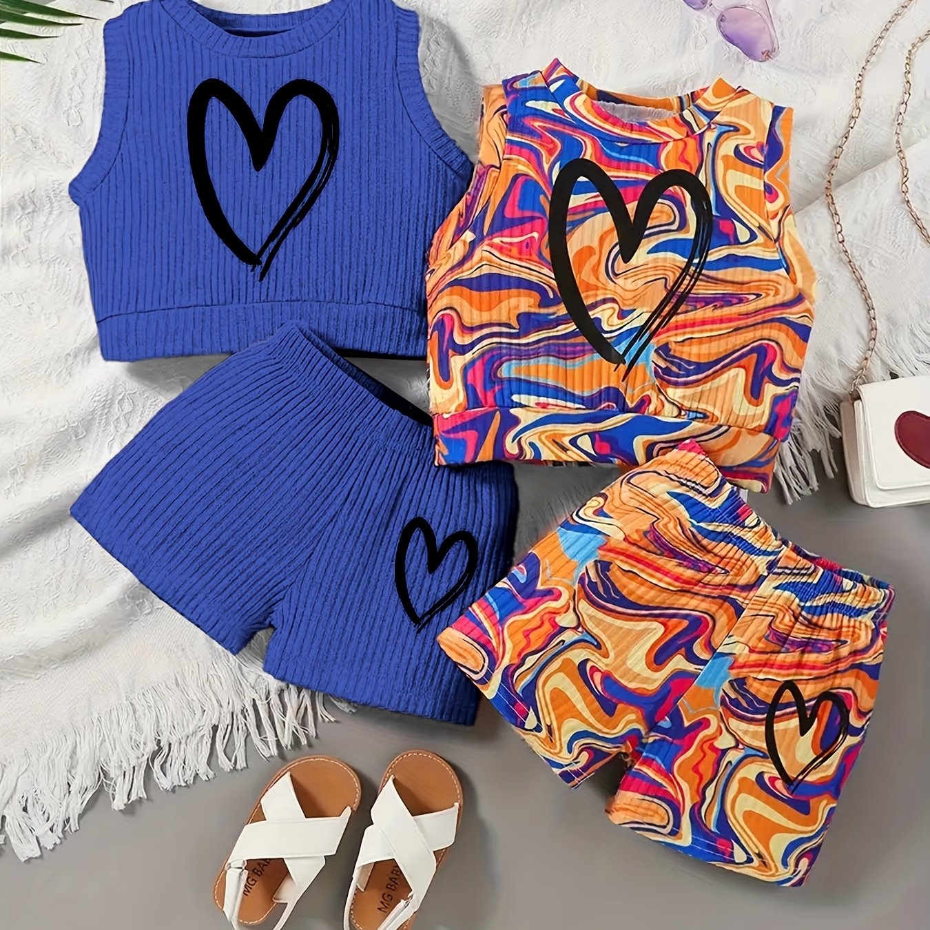 4-piece girls' summer outfit set featuring a strapless heart print tank top and shorts. Made of casual polyester knit fabric with medium stretch for a loose fit. Ideal for outdoor