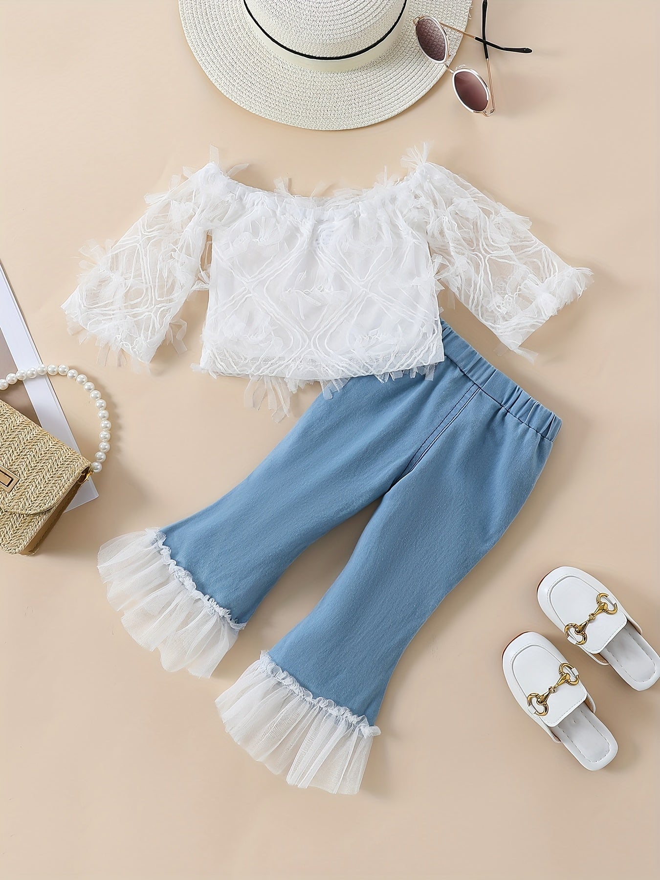 Stylish girls' summer outfit: off-shoulder white lace top with blue tulle flared pants set. Made of 100% polyester, machine washable. Perfect for outdoor wear.