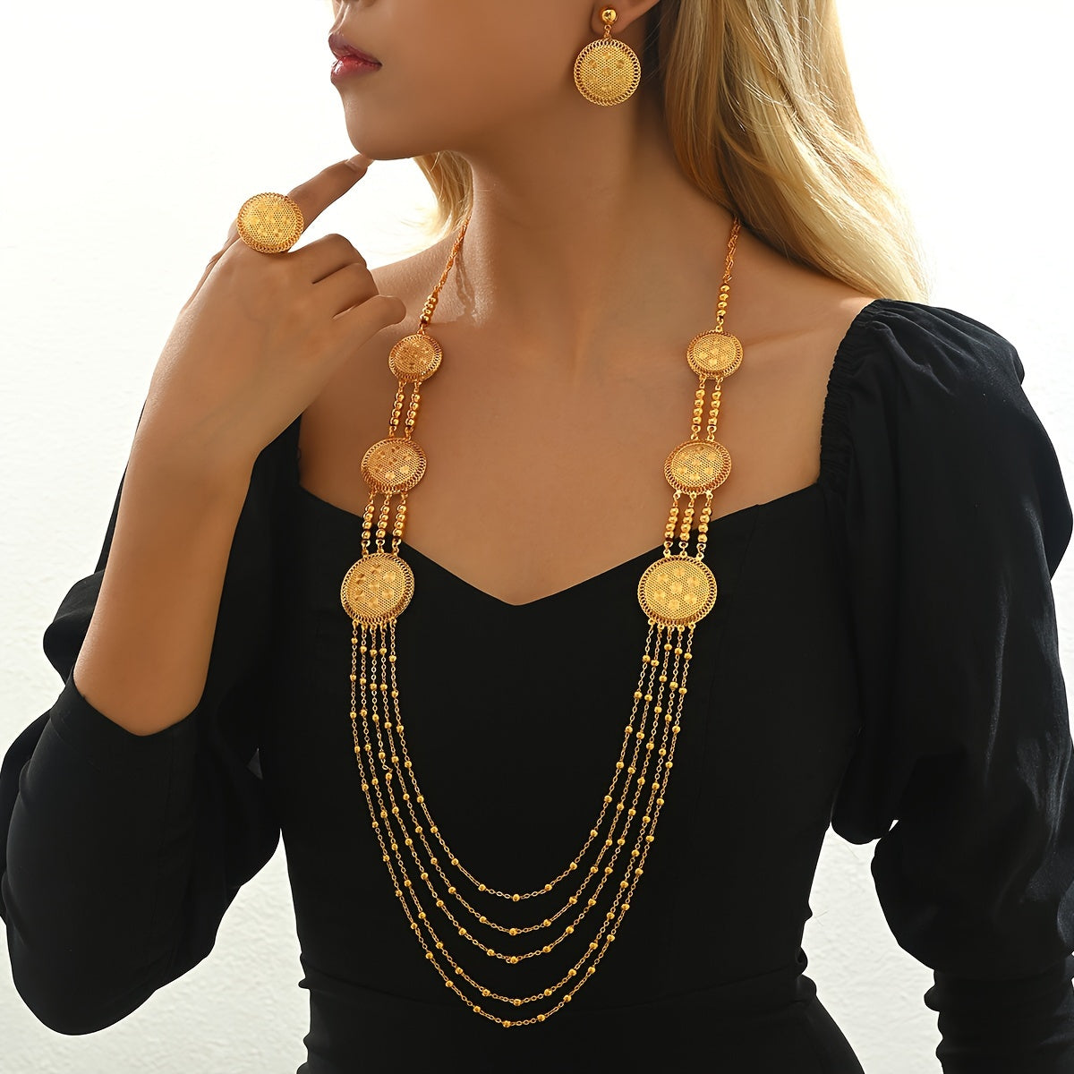 Four-piece set of stylish, luxury tassel jewelry including necklaces, earrings, and rings, perfect for women's banquets, weddings, and special occasions in the Middle East during Ramadan. Ideal for accessorizing, gifting, and adding a touch of elegance