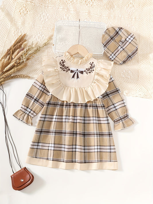 Stylish plaid dress with ruffle trim and matching hat, great for spring and fall. Machine washable.