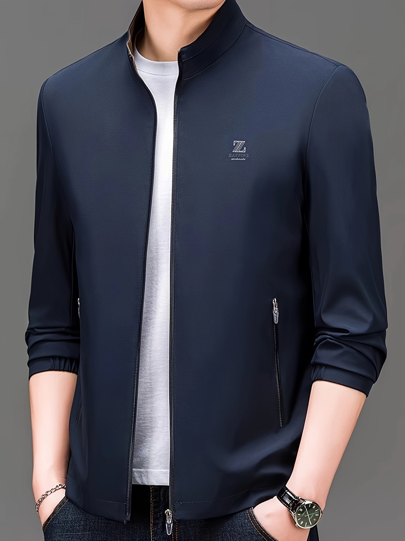 Men's stand collar jacket made from 100% polyester woven fabric in a solid color. Features a regular fit and zipper closure, suitable for spring/fall wear. Fashionable outerwear for