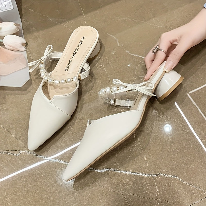 Stylish French-inspired mules for women, featuring a faux pearl ankle strap and chunky heel, perfect for outdoor wear in Summer 2024.