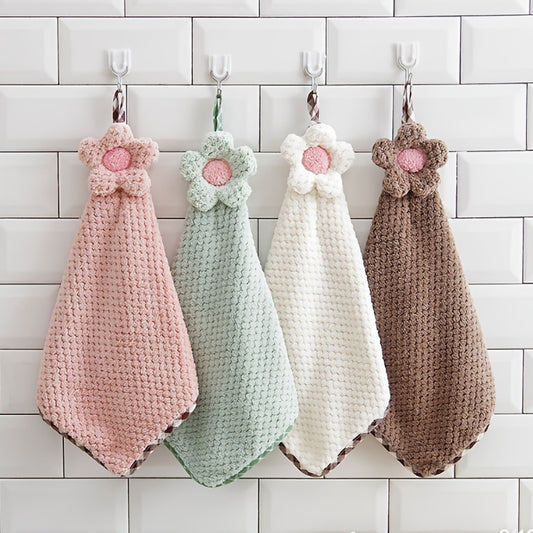 Decorative crochet flower hand towel made of absorbent microfiber with hanging loop. Perfect for kitchen or bathroom use in pink, mint green, white, or brown.