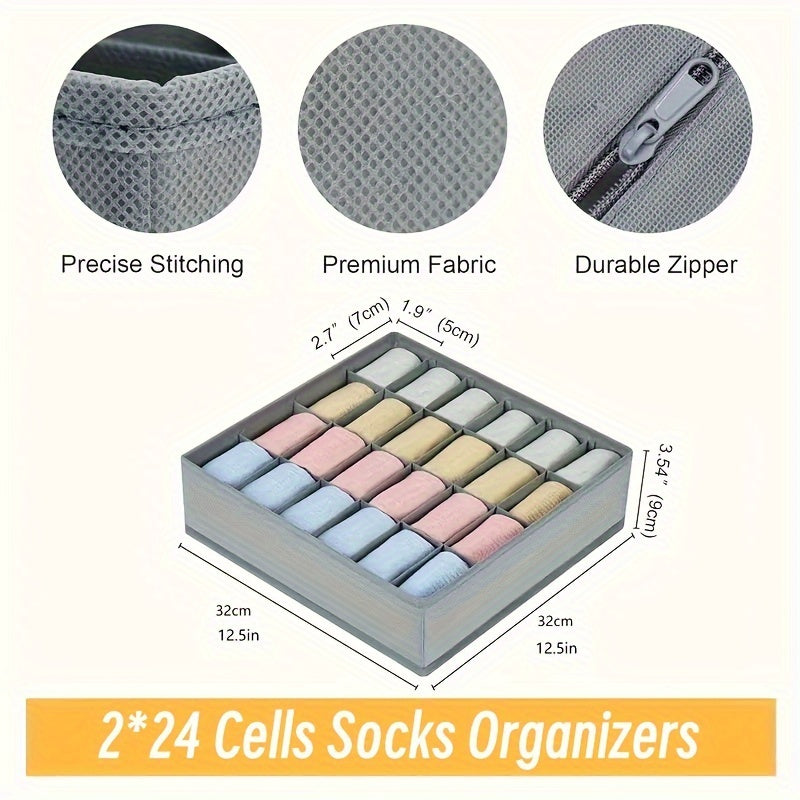 Pair of foldable organizers with 24 compartments for socks, underwear, bras, and ties. Made from breathable fabric with a durable zipper for versatile storage options. Can be used in the