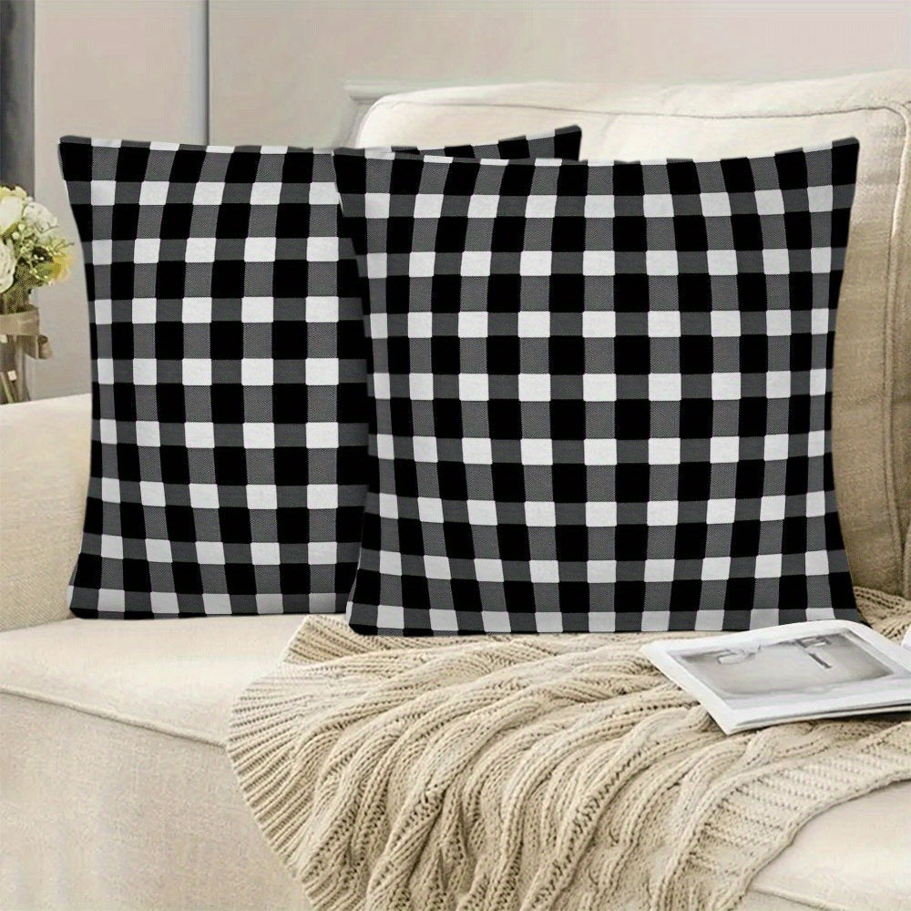 Two-pack of contemporary black and white checkered flannel pillow covers measuring 45.72x45.72 cm. These machine washable, zippered square cushion cases are perfect for use on your sofa, bed, or outdoor furniture in any season. Please note that pillow