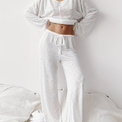 Women's two-piece set of loose and comfortable home clothes made with micro-permeable fabric, featuring round neck and long sleeves.