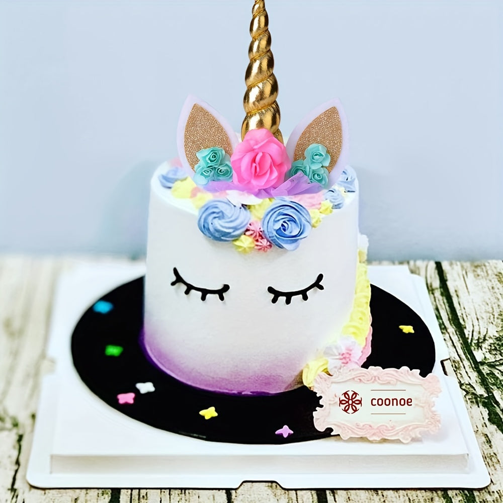 Unicorn cake topper set includes 3 pieces with eyelashes and golden horn, perfect for decorating birthday cakes.