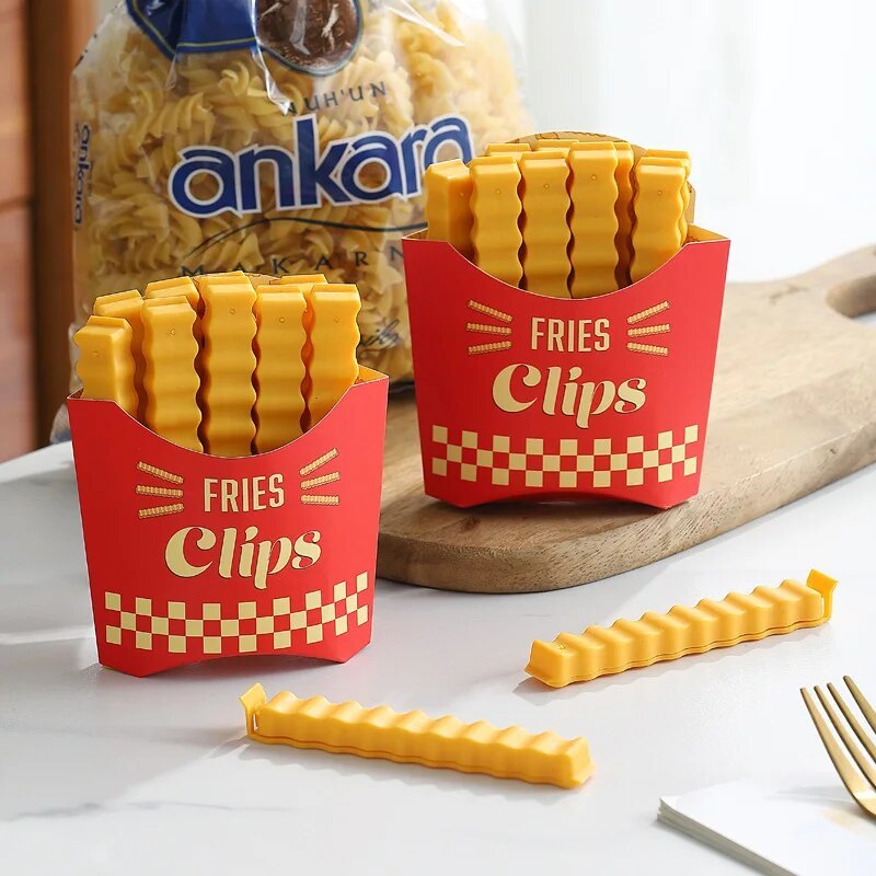 Keep your snacks, bread, and more fresh and sealed with these cute French fry-shaped bag clips! This set includes 12 pieces of durable plastic clips that are moisture-proof and perfect for keeping your snacks fresh. Perfect for any kitchen, these