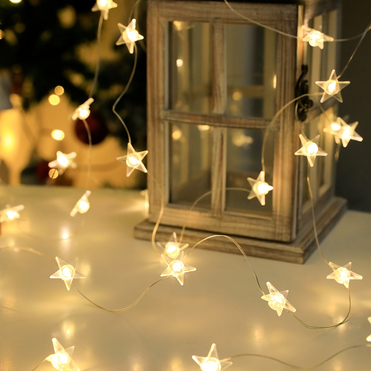 Star-shaped LED fairy lights in modern copper wire designs are available in 1m, 2m, and 3m lengths with 10, 20, and 30 LEDs respectively. Designed for universal holiday decor, these lights are battery operated and do not contain feathers.