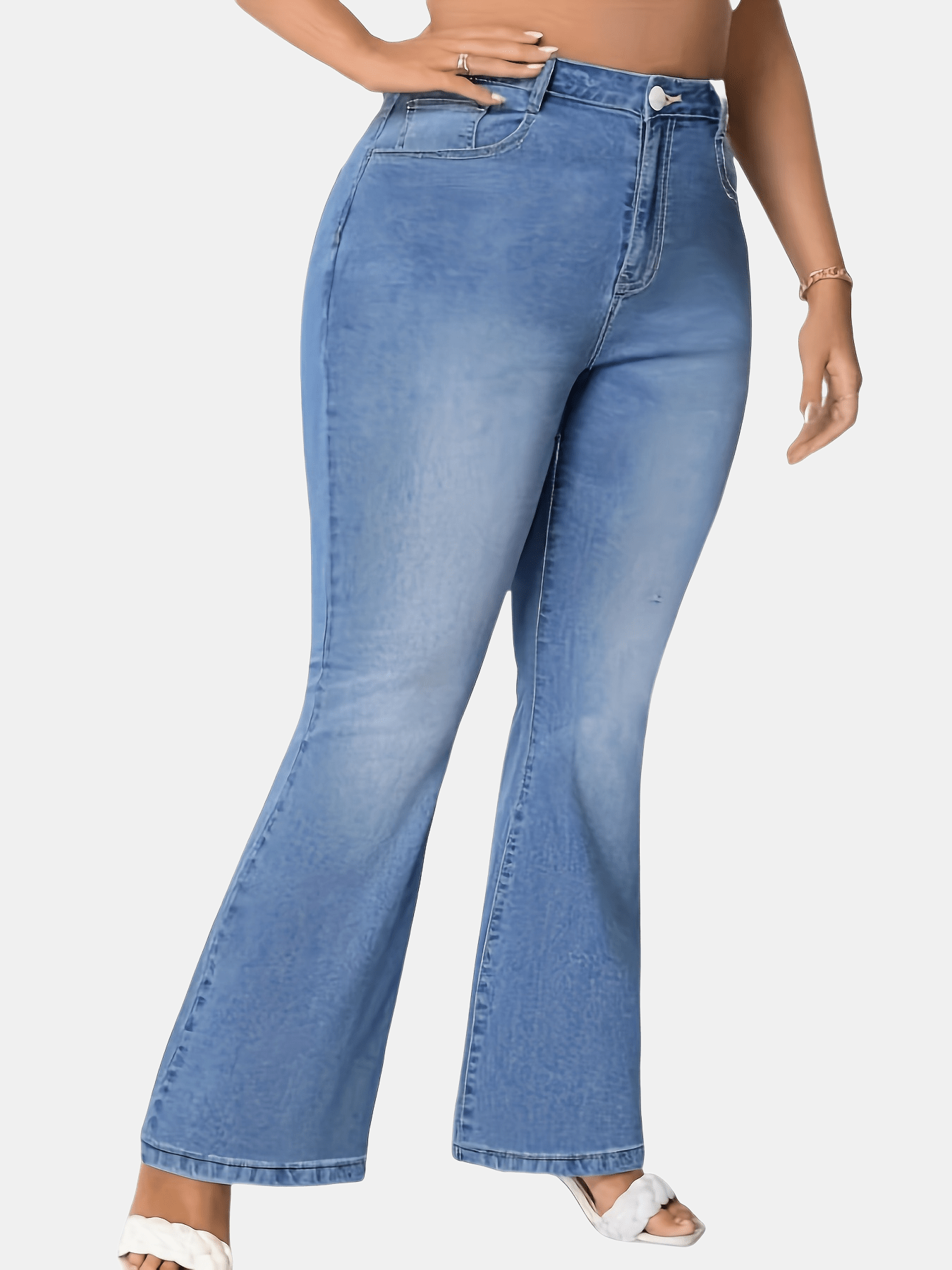 Women's plus size blue flare jeans made of stretch denim with a classic button closure, perfect for casual wear.