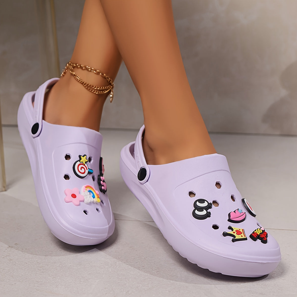 Elegant summer clogs for women - breathable beach sandals with thick soles and charm detail, versatile slip-on shoes for outdoor wear.