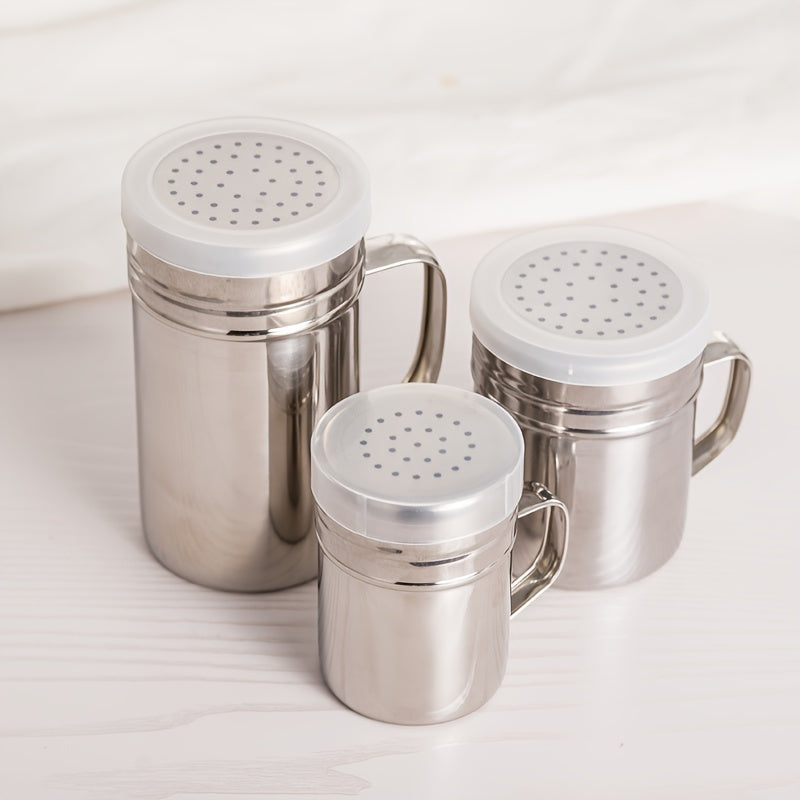 Durable stainless steel seasoning jar with handle perfect for BBQ spice, pepper, and sesame powder. Ideal for home, restaurant, or café use. Modern design and practical spice container.