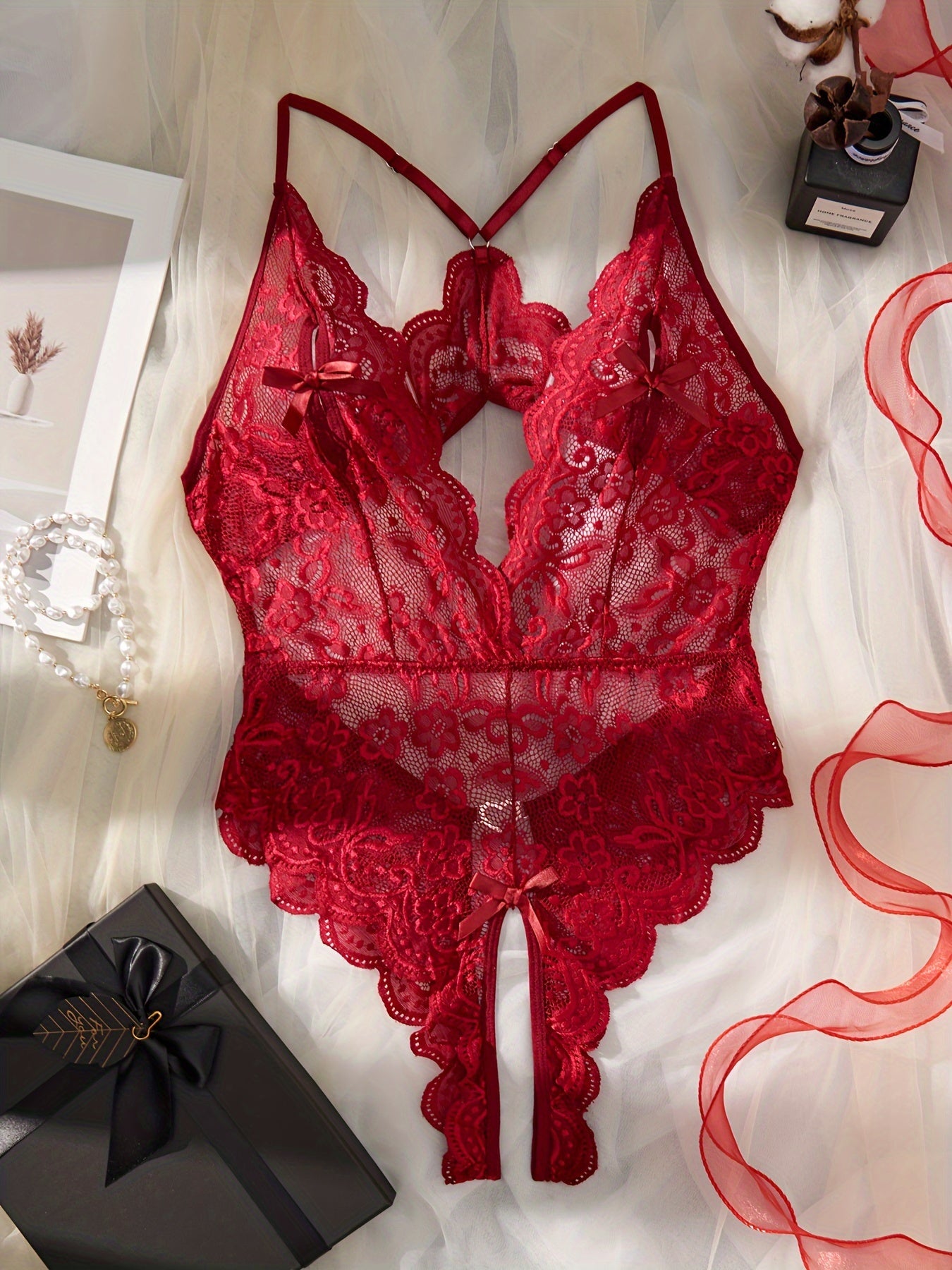 Sexy lingerie set featuring a floral lace teddy with scallop trim and a mesh bodysuit with heart ring detail and backless design.