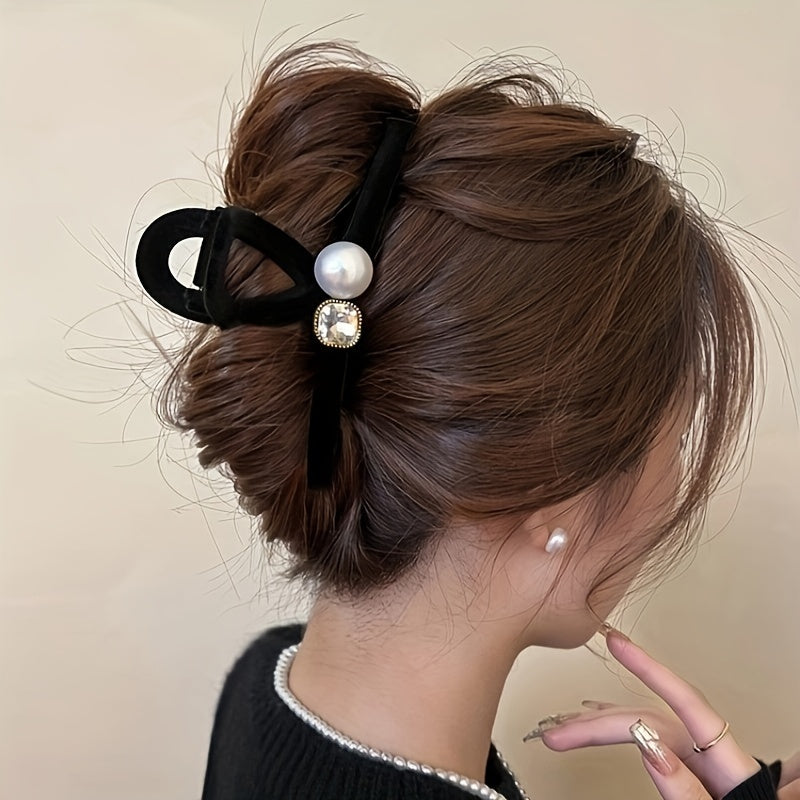 Large velvet pearl hair claw clip with faux pearls and crystals. Elegant black ribbon bow design, perfect for ponytails and updos. Shark accessories for women.