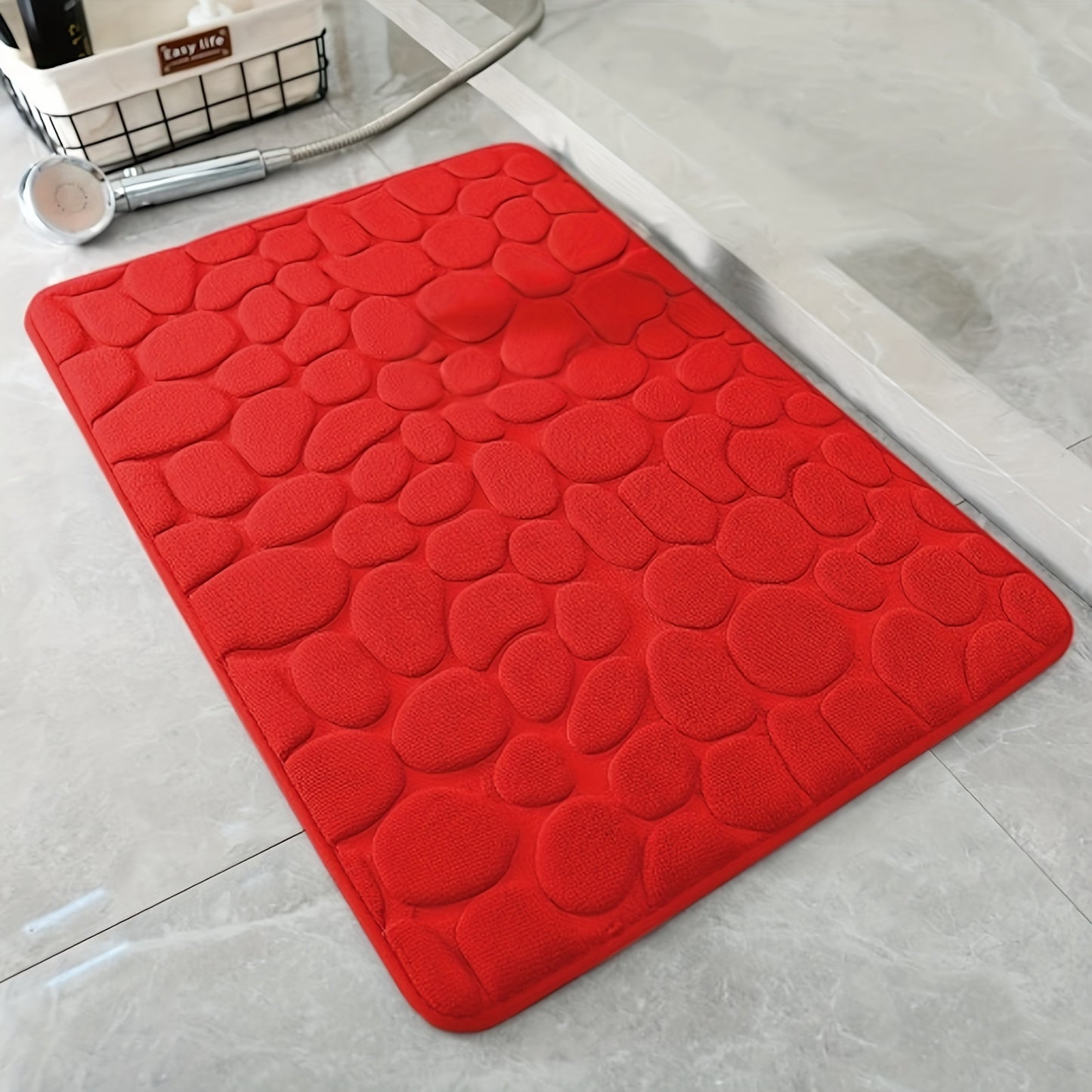 Pebble pattern bath mat in blue winter wonderland design. Non-slip, absorbent, machine washable, and fluffy.