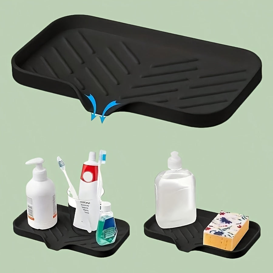 Silicone sink mat with soap dispenser, sponge drain, and countertop storage tray for drying and organizing bathroom accessories.