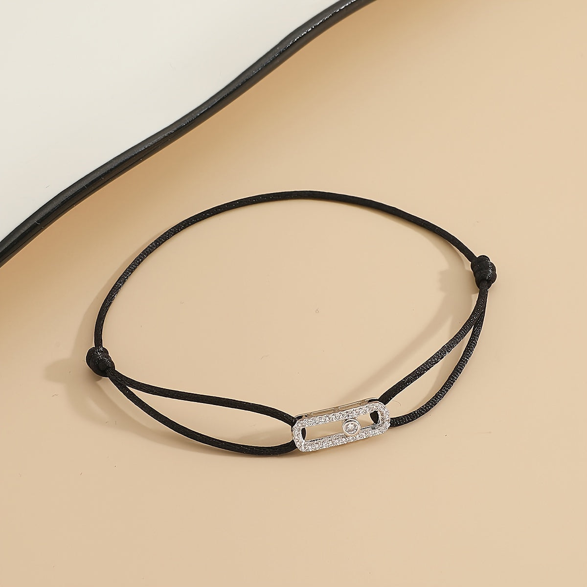 A stylish and timeless charm bracelet designed for women, featuring adjustable sizing and movable zirconia accents. This premium accessory is the perfect gift for any fashionable woman who appreciates high-quality jewelry.