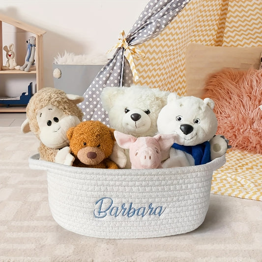 Personalized embroidered gift basket with handles, ideal for organizing collectibles, pet beds, and more. Measures 30.48 cm X 20.32 cm X 12.7 cm.