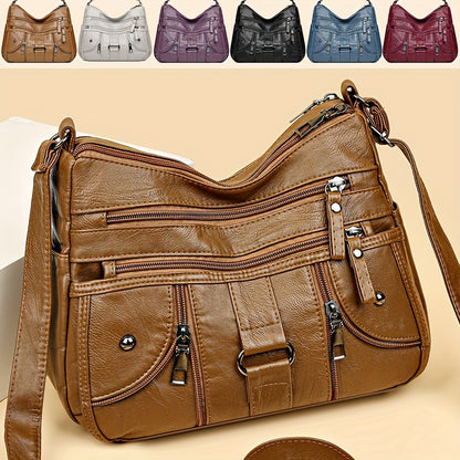 Women's synthetic leather crossbody bag with adjustable strap and anti-theft zipper closure. Large capacity with polyester lining, solid color, and multi-pocket design. Ideal for everyday