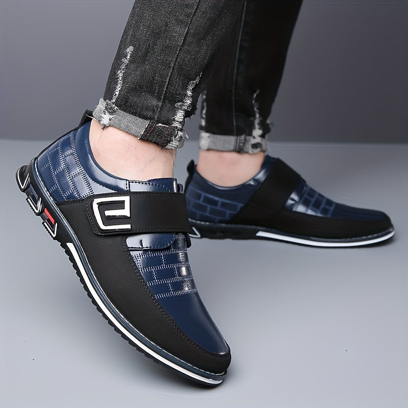 Men's dress loafers with hook and loop fastener for business or casual wear.