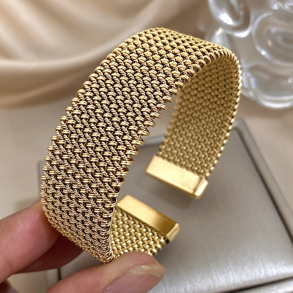 Stylish woven stainless steel bracelet with a golden touch, versatile accessory in trendy golden tone.