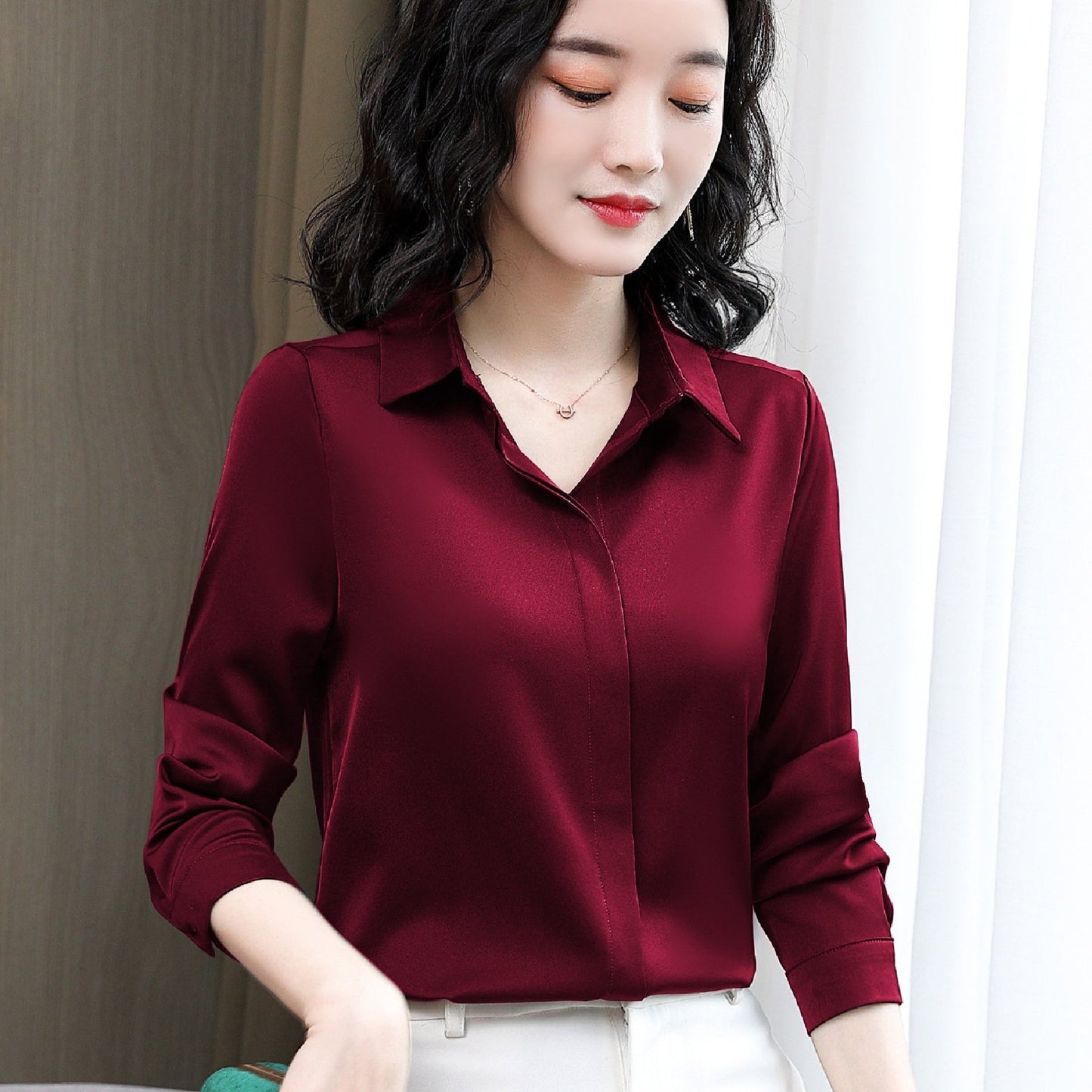 Long sleeve satin shirt with solid color, collared button-up design for women. Machine washable and perfect for spring/fall. Ideal for sophisticated adults with luxurious style.