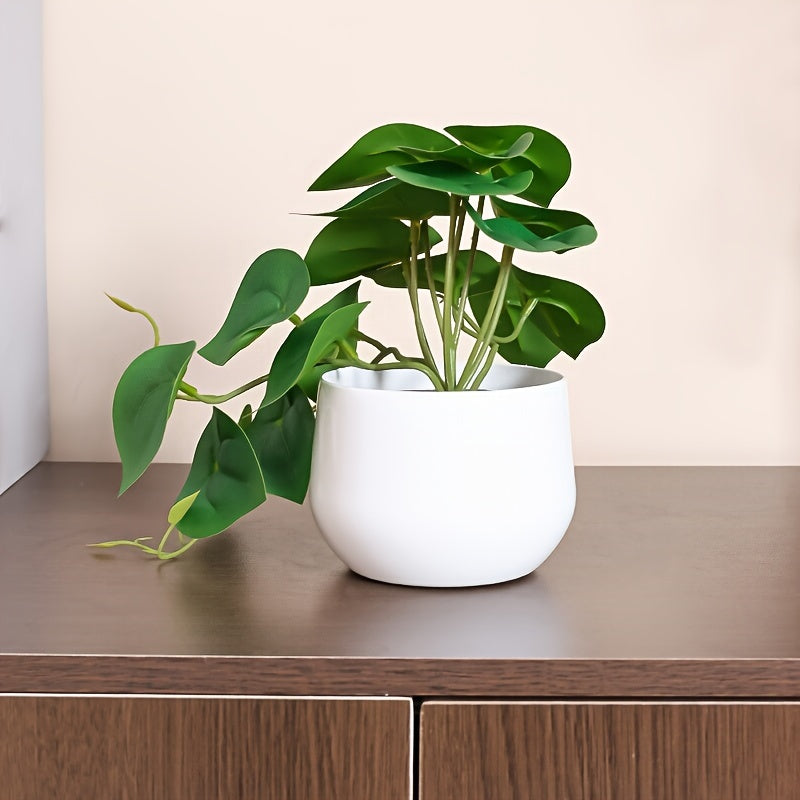 Artificial green leaf plant for home, office, or shelves décor.