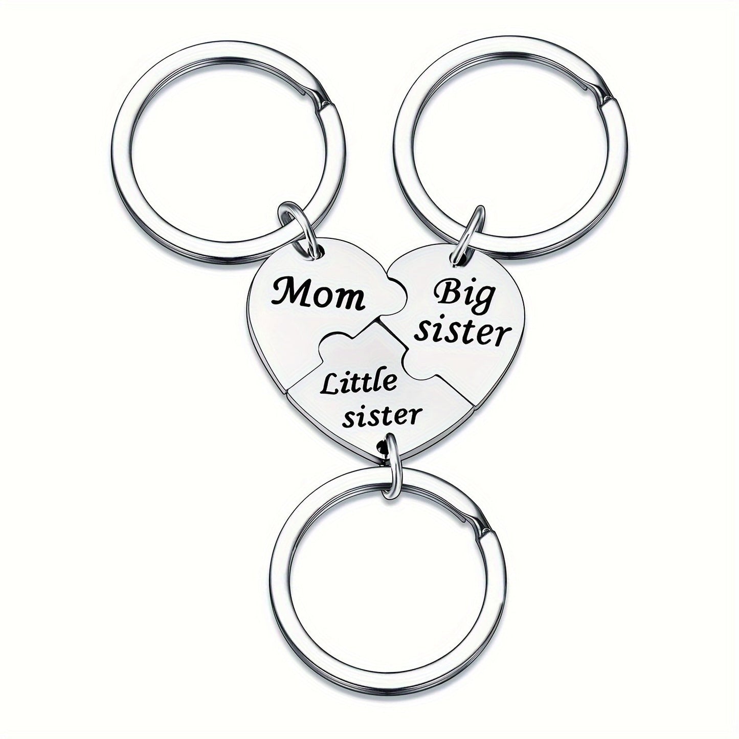 Set of three heart-shaped keychains for mothers and daughters, engraved with "Mom," "Big Sister," and "Little Sister." This matching pendant accessory set symbolizes family connection.