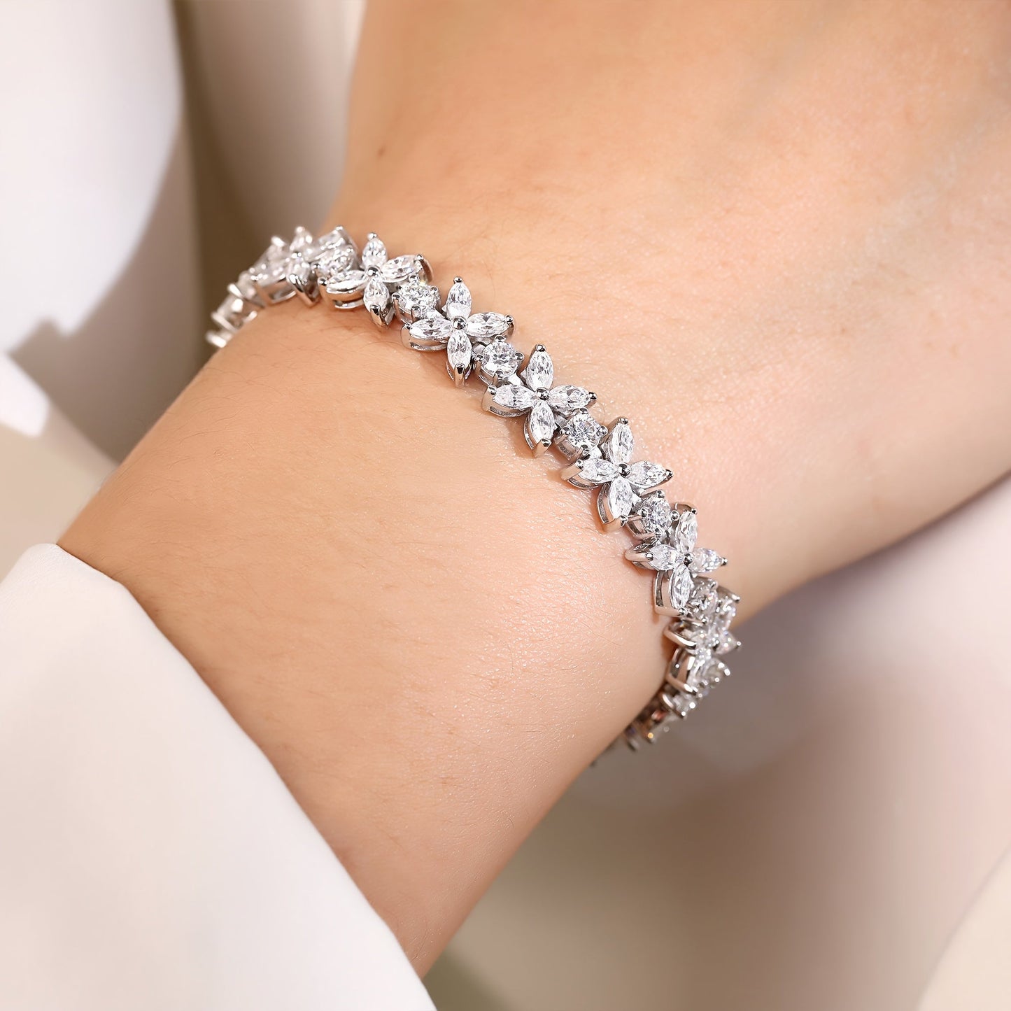 The Oneida Elegant Butterfly Bracelet features stunning 2MM synthetic Moissanite stones set in 925 silver. This bracelet is the perfect gift for November birthdays, plated with platinum for a luxurious finish. Ideal for any occasion, this bracelet comes