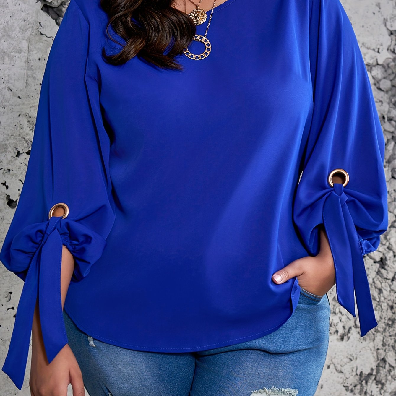 Elegant plus size royal blue satin blouse with tie sleeves, round neck, and smooth texture. Perfect for spring, summer, and fall.