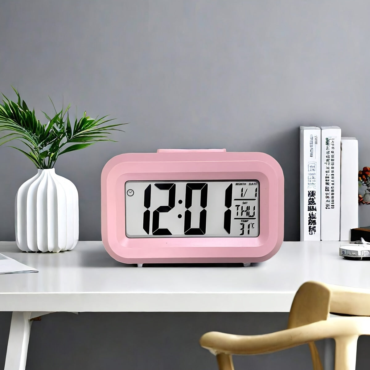 Compact pink mini LED desk clock with backlight, temperature, and calendar. Multifunctional kitchen timer for students. Sleek rectangular design with digital display. Battery-powered (AAA). Minimalist aesthetic.