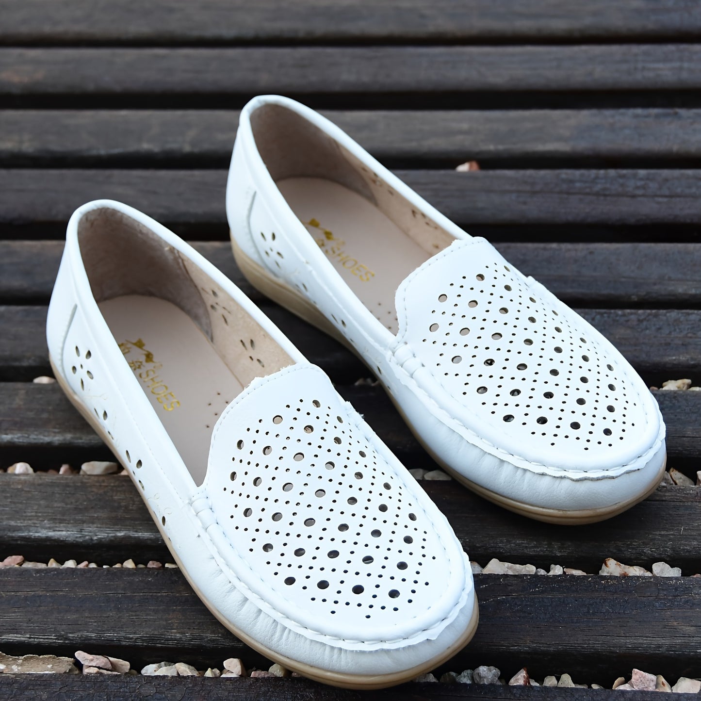 Women's white slip-on loafers with perforated design for breathability, non-slip sole, round toe, and versatile casual style for all-season wear.