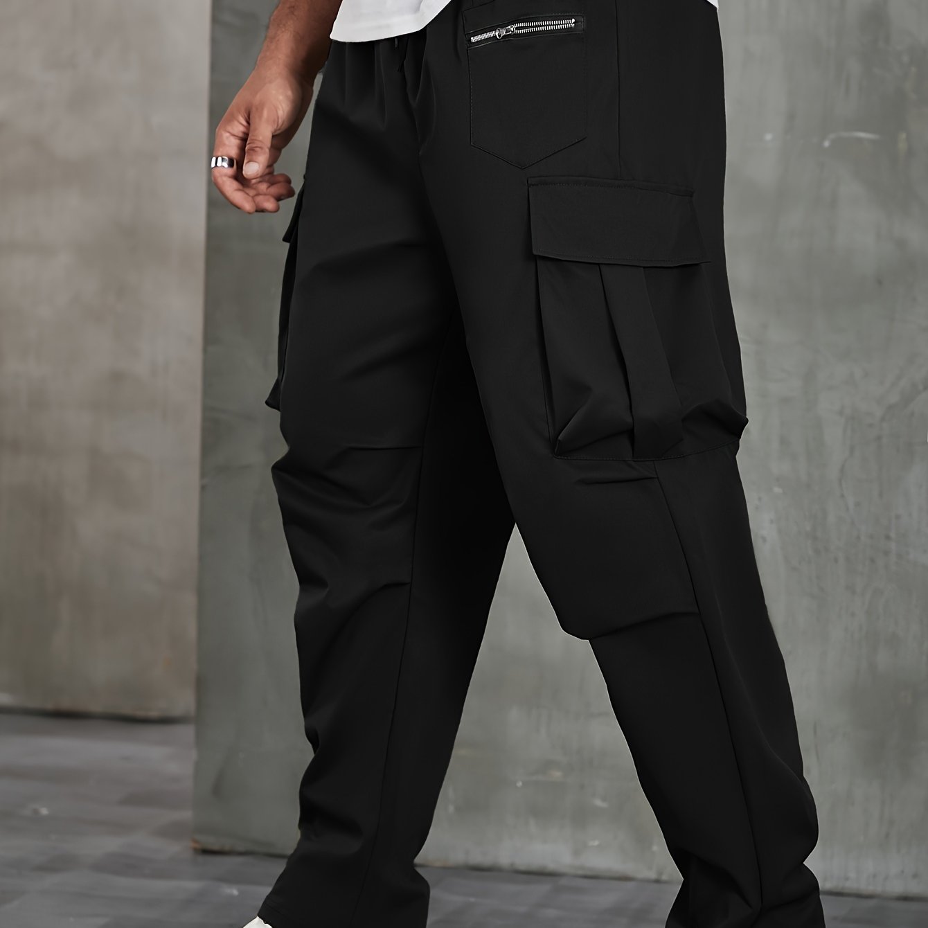 Men's solid cargo pants in plus sizes for spring and fall outdoor sports.