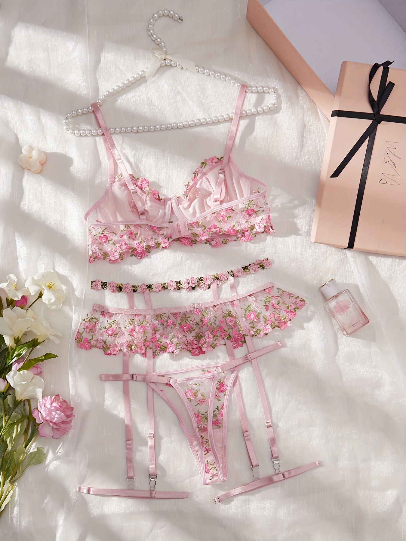 Mesh flower embroidered lingerie set with leg straps, including bra and thong. A sexy addition to women's underwear collection.