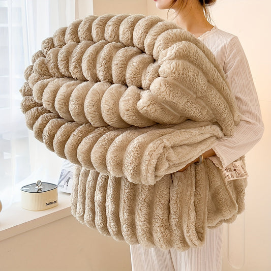 Luxurious faux rabbit fur plush blanket in a cozy striped milk velvet throw design. Made from high weight flannel coral fleece, this blanket is soft and warm for all seasons. It is machine washable and comes in a solid beige color.