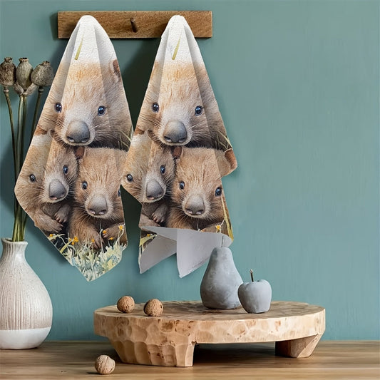 Two pieces of ultra soft kitchen towels featuring a watercolor-style design of wombats waddling through the grass, symbolizing a slow and steady love. These highly absorbent dish hand towels are perfect for holiday decor. They are machine washable and