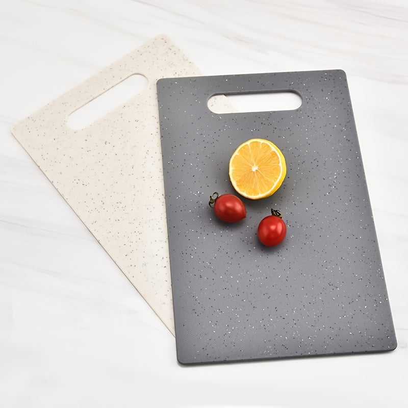 Set of 4 household kitchen cutting boards made of plastic. This multifunctional set includes a chopping board with an easy-grip handle, a cutting board mat, and is perfect for cutting fruits. Ideal for kitchen and dorm supplies.