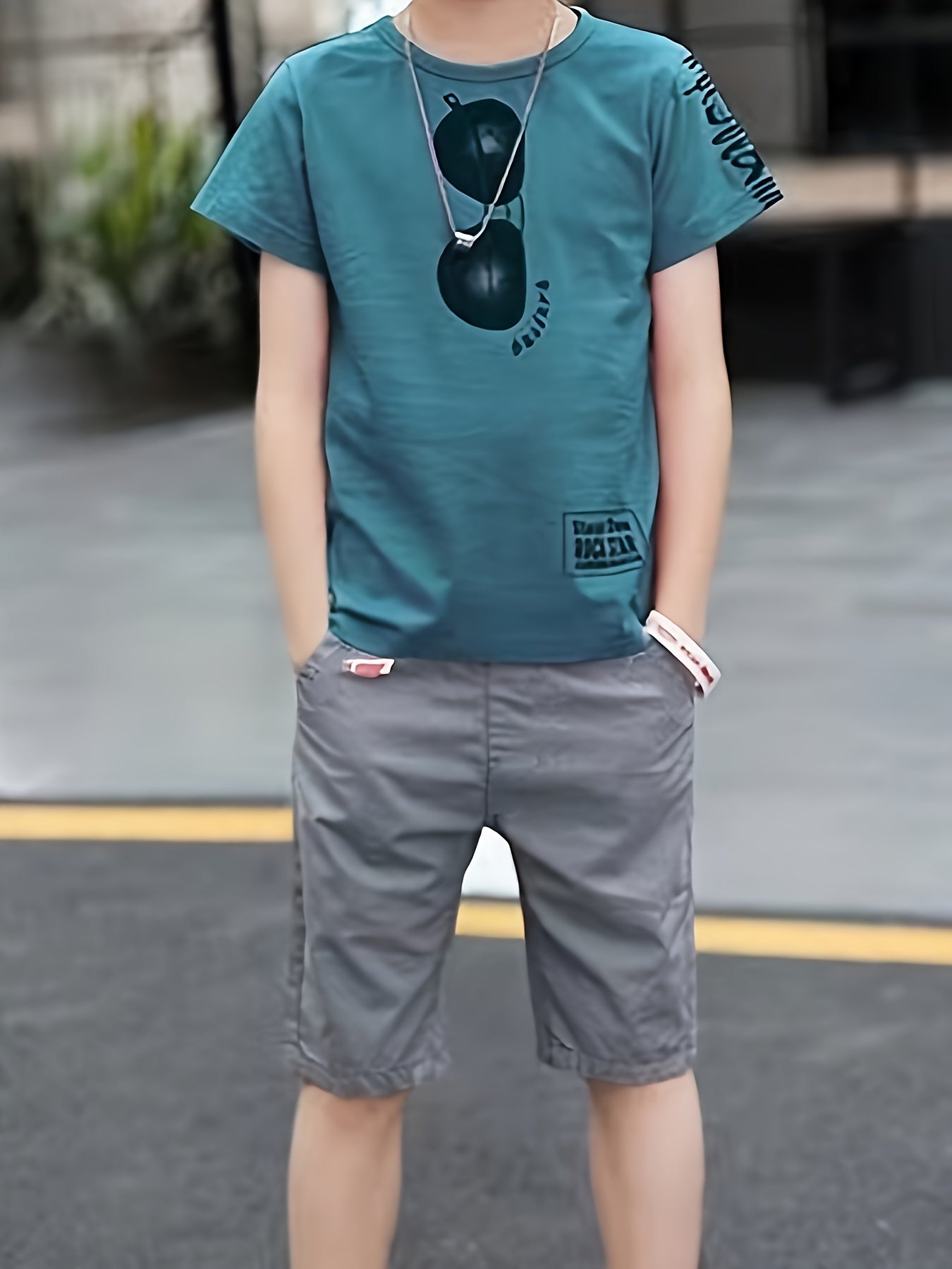 Boys' two-piece set with glasses print t-shirt and shorts, ideal for summer outdoor activities.