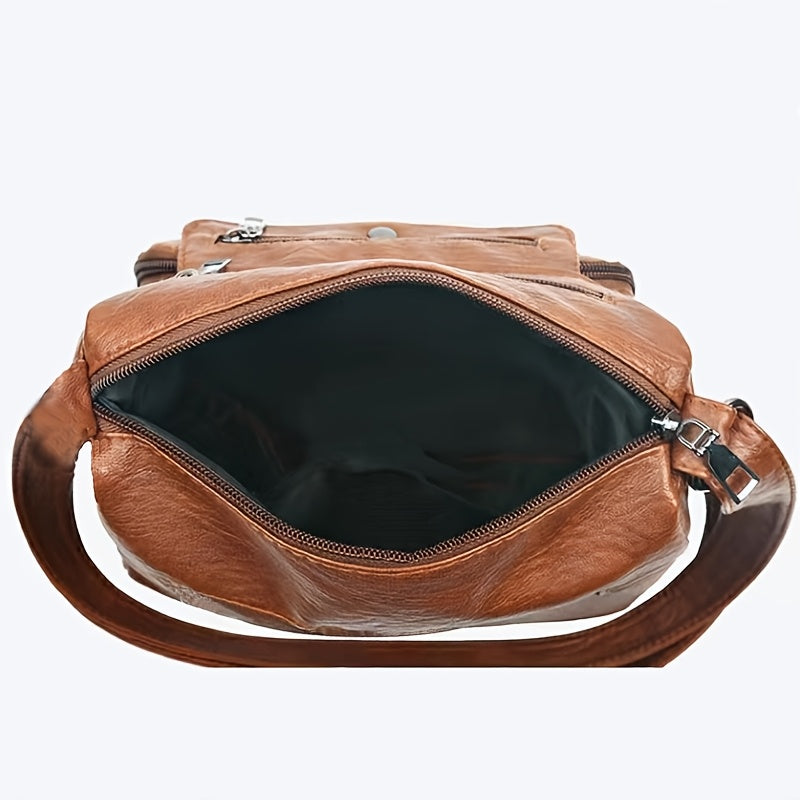 Ladies' faux leather crossbody bag with adjustable strap and magnetic closure.