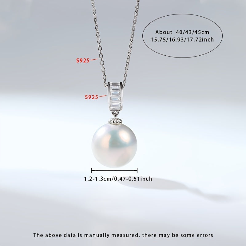 Surprise your loved one with this must-have gift - a stunning Pearl Necklace! This beautiful pendant necklace is made with S925 silver and features a 12-13mm round natural freshwater pearl. Each necklace is unique as natural pearls come in varying shapes