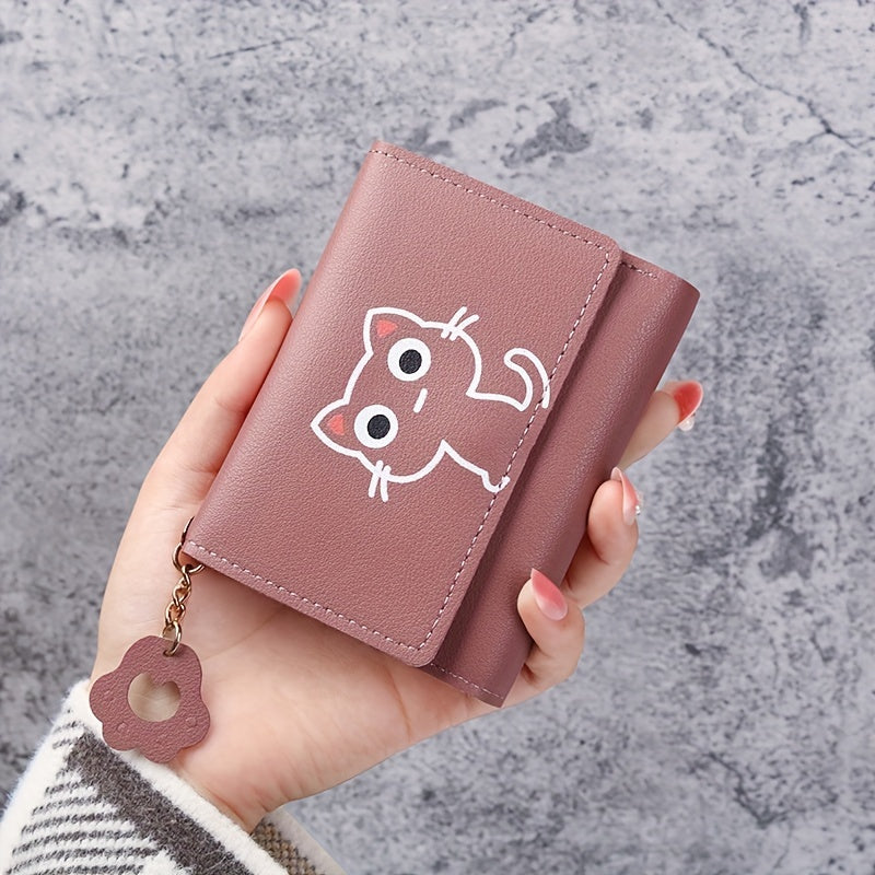 1 Cute Cat Cartoon Mini Wallet for Women made of pink faux leather, features a short tri-fold design with key ring and heart charm. Ideal for daily use and as a gift for cat lovers.