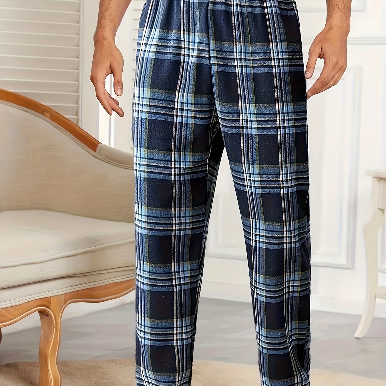 Comfortable men's sleep pants with tartan pattern, elastic waist, and pockets. Made from 95% polyester and 5% spandex, lightweight and soft. Suitable for all seasons.