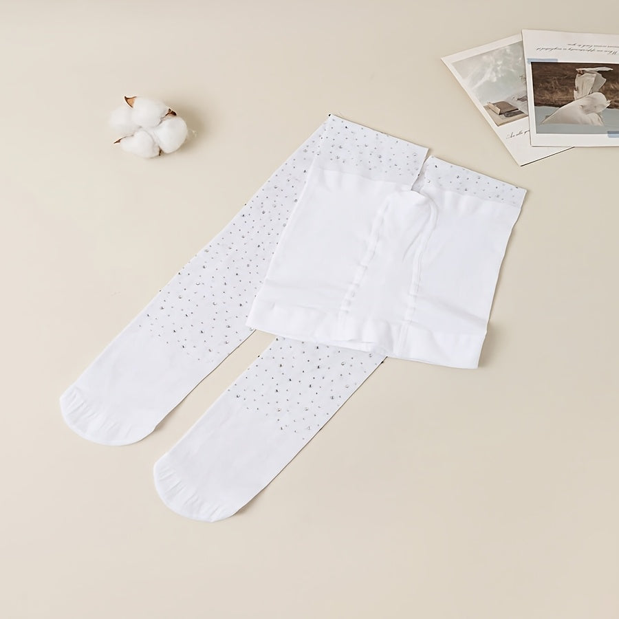 2 pairs of black and white rhinestone-studded tights for baby girls.