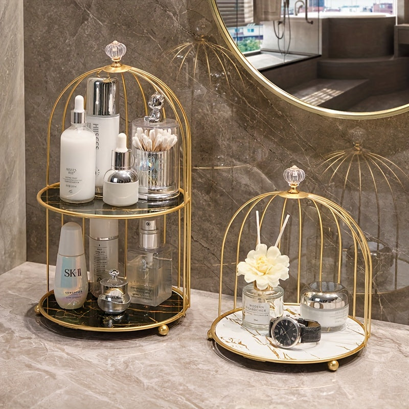 Luxury gold-toned cast iron makeup organizer with cage-shaped bathroom shelf for elegant display of perfumes and skincare products on vanity or countertop.