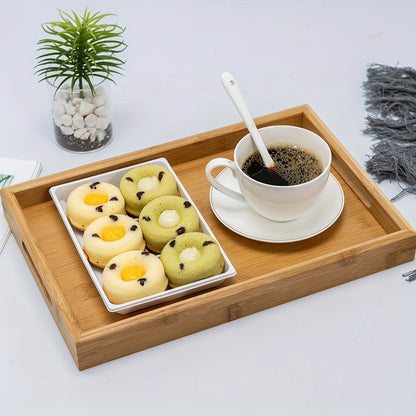 Bamboo serving tray with handles for eating, working, and storing in various locations.