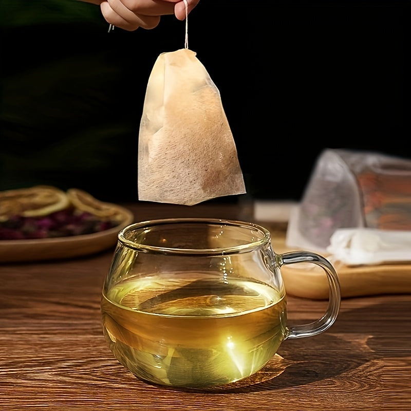 Disposable paper tea filter bags with drawstring, unbleached and safe for loose leaf tea and coffee. These 100pcs tea infuser sachets are made with strong penetration for easy brewing.