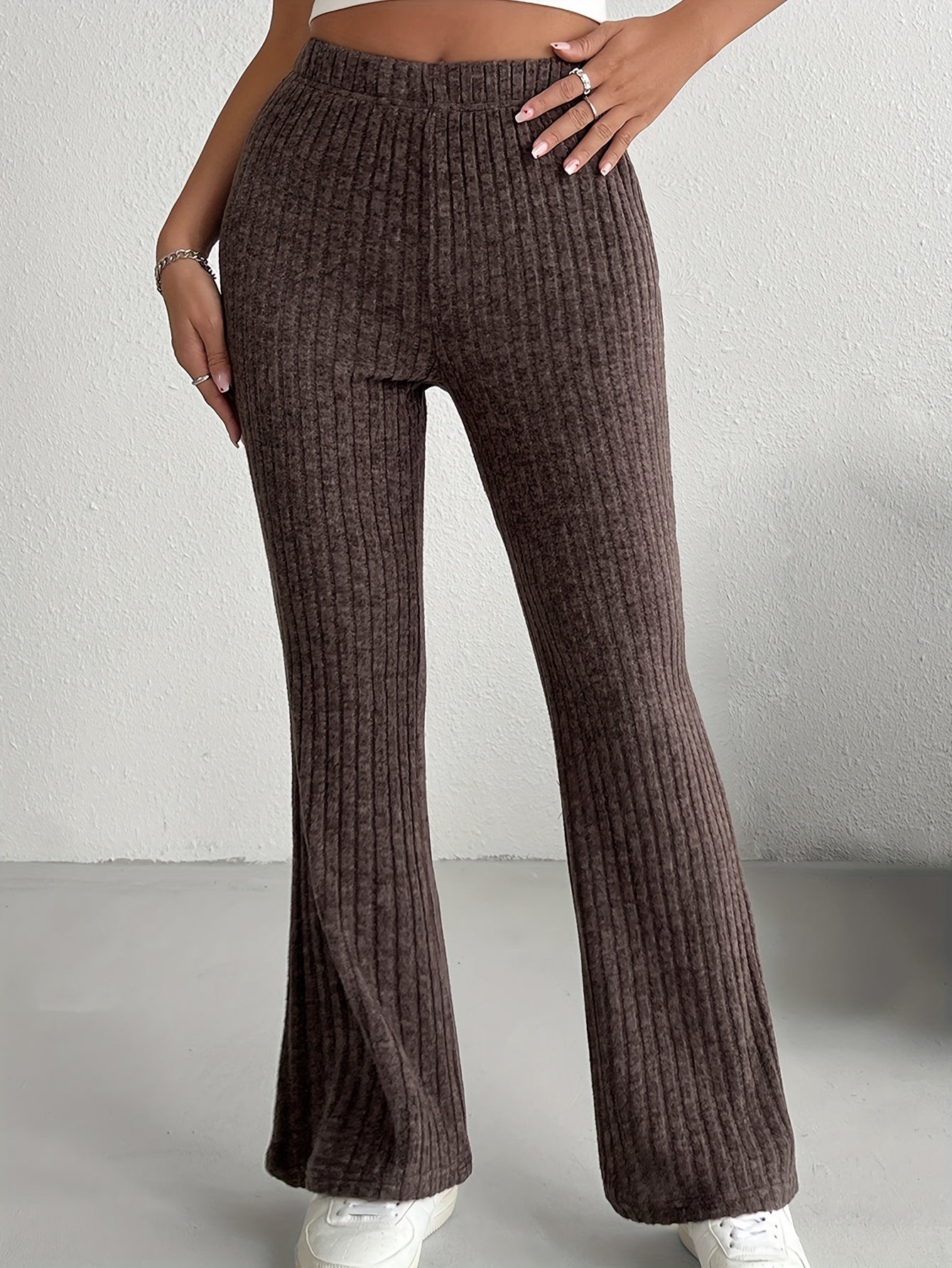 Women's elegant solid color knit flare pants made of a soft and comfortable polyester blend, perfect for all seasons, with a fabric weight of 210g/m².