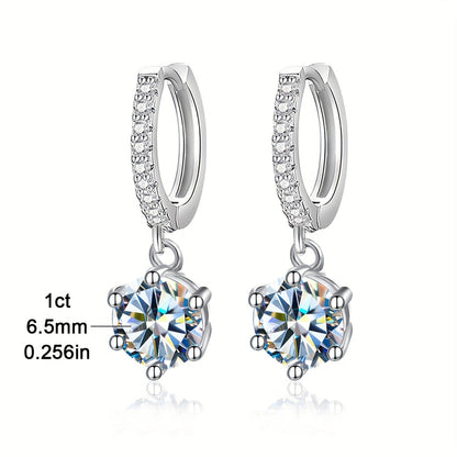 Elegant and luxurious 925 silver earrings designed with six prongs and inlaid with shiny 1ct Moissanite. Perfect for ladies, ideal for special occasions like banquets, anniversaries, or birthdays. A fashionable and delicate accessory weighing 2.6g.