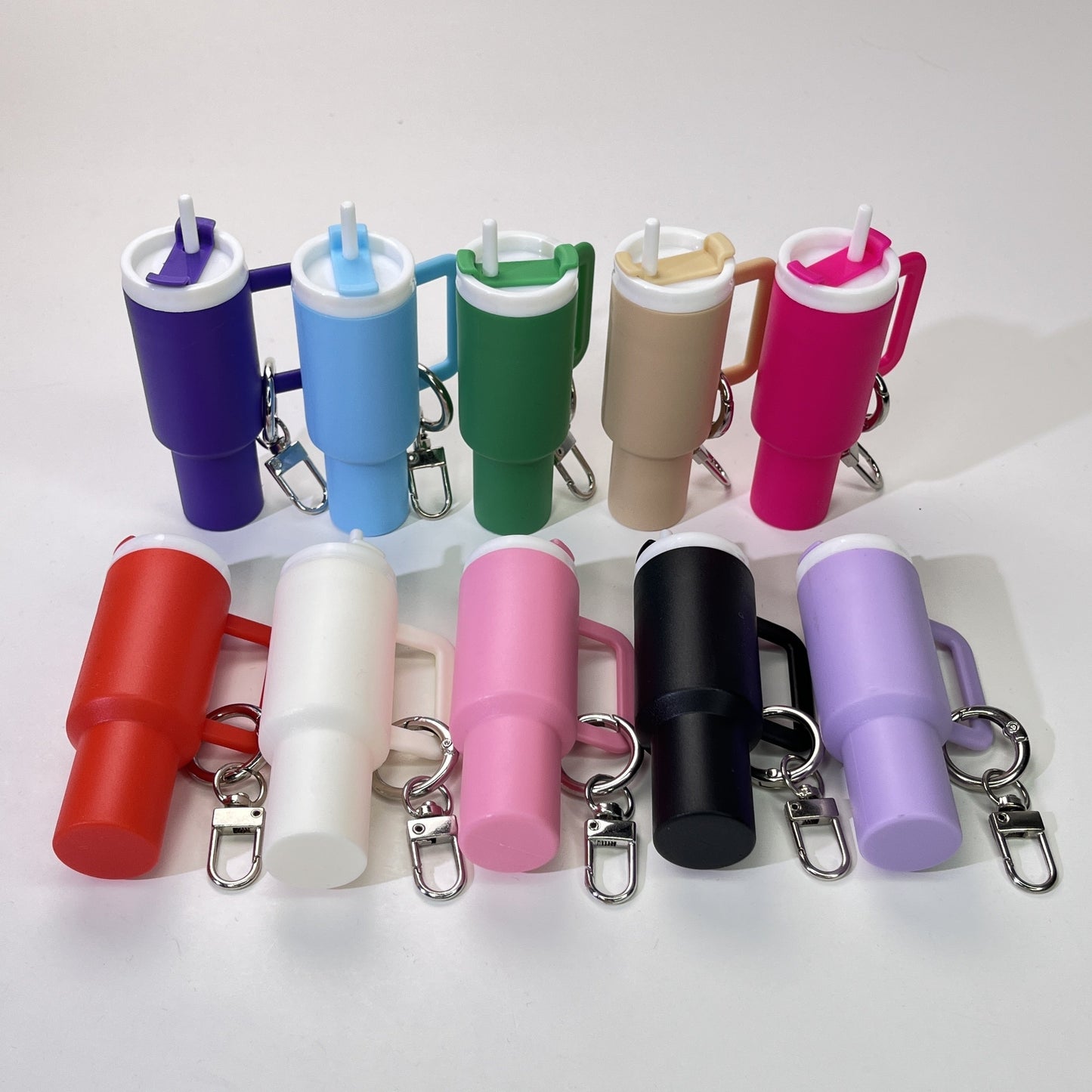 Set of Mini Nonpareil Drink Container Keychain includes 6 pieces out of a set of 10. Includes removable lipstick and lipgloss organizer. Made of funky PVC material, this keychain is ideal for backpacks and car keys. Perfect gift for friends and sports