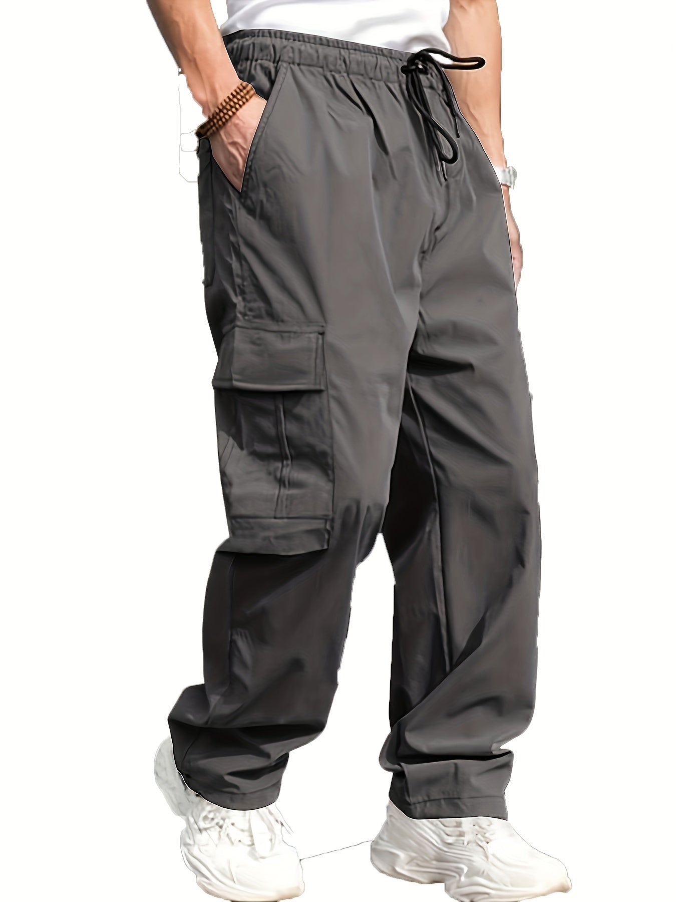 Men's cargo pants for outdoor activities with multiple pockets and drawstring waist.